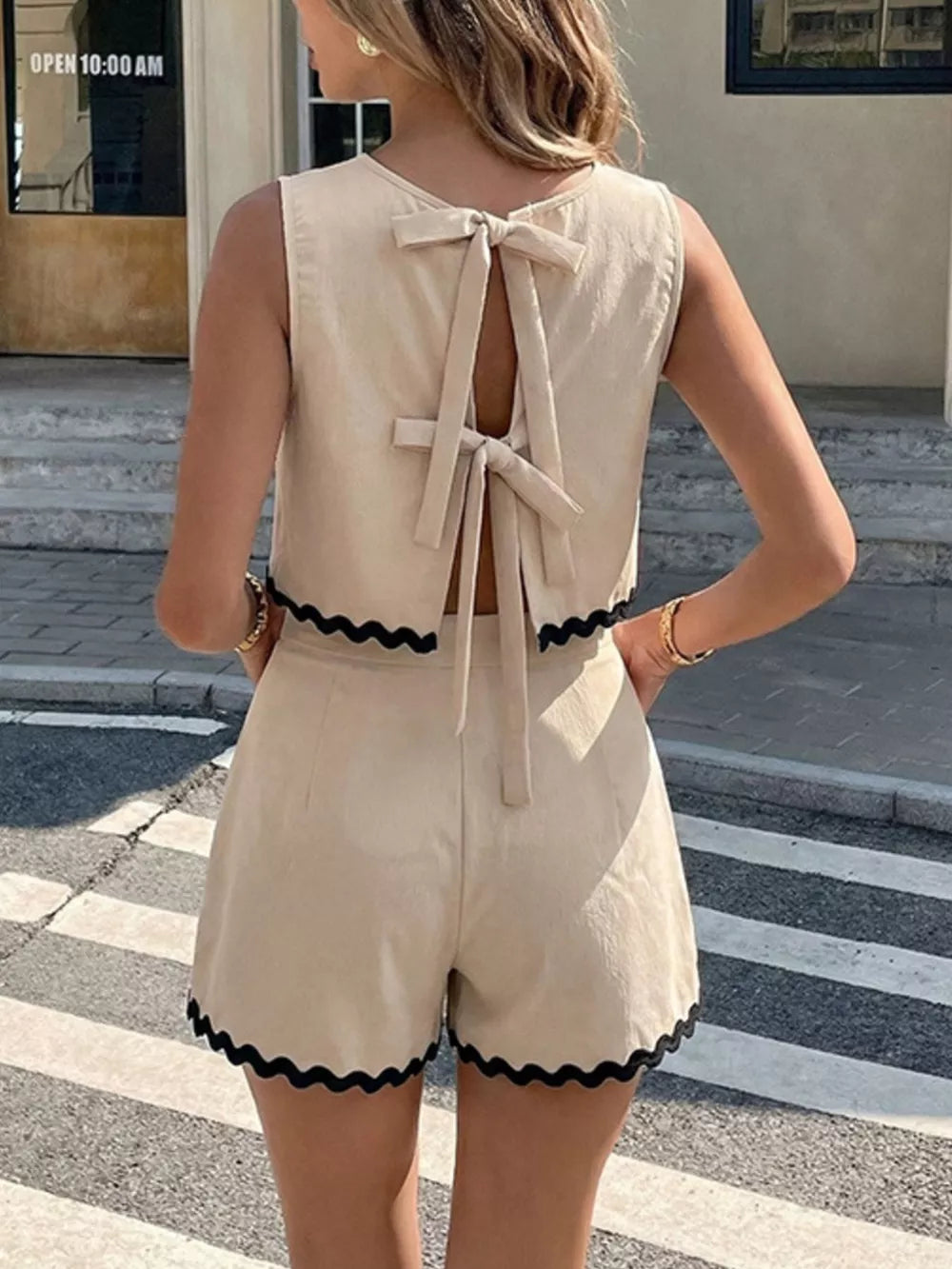 Scalloped trim tank and shorts set in beige with back tie closure and black scalloped trim.