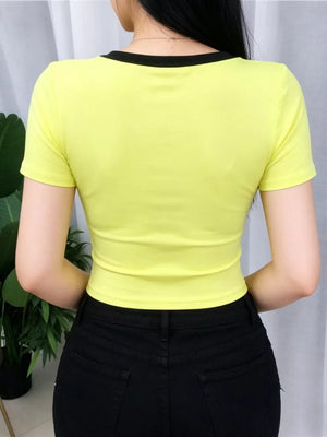 Yellow maternity crop t-shirt with black trim neckline and short sleeves.