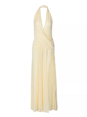 Yellow halter neck ruched maxi dress with deep V-neckline and thigh-high slit.