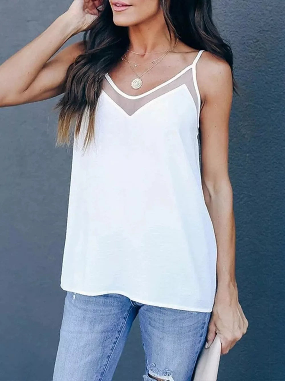 White cami top with sheer V-neck insert and adjustable spaghetti straps