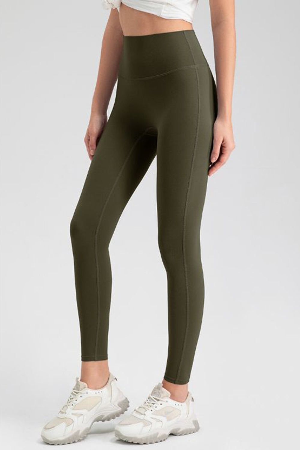 Olive green high-waist performance leggings with sculpting seams.