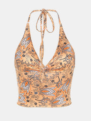 Paisley print halter top in tangerine with ruched detail and tie neck.