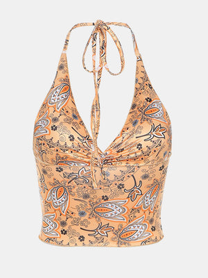 Paisley print halter top in tangerine with ruched detail and tie neck.