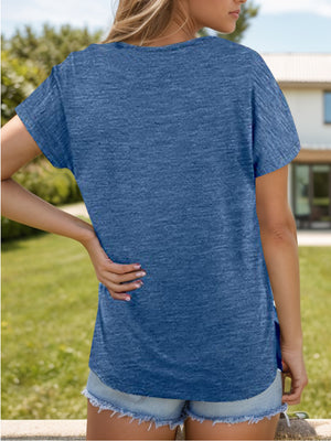 Dusty Blue relaxed fit tee with short sleeves and side slits, styled with denim shorts.