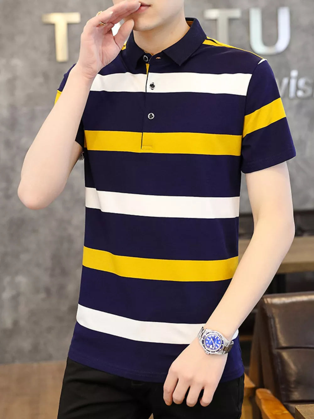 Men's navy, white, and yellow striped cotton polo shirt with buttoned placket.