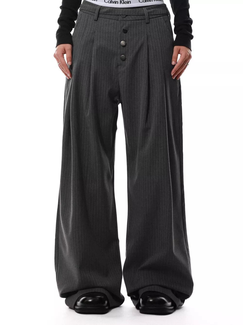 Charcoal pinstripe wide-leg maternity trousers with button-front detail and pleats.