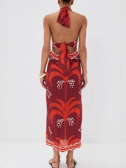 Tropical print halter neck maxi dress with cutout back and tie detail.