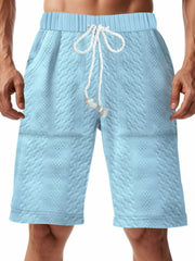 Light blue quilted texture drawstring chino shorts with diamond pattern.