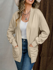 Tan textured knit open-front cardigan with pockets and ribbed trim.