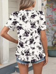Women's white floral print short sleeve blouse with a casual fit.