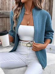 French blue ribbed zip-up sweater with mock neck and silver zipper detail.