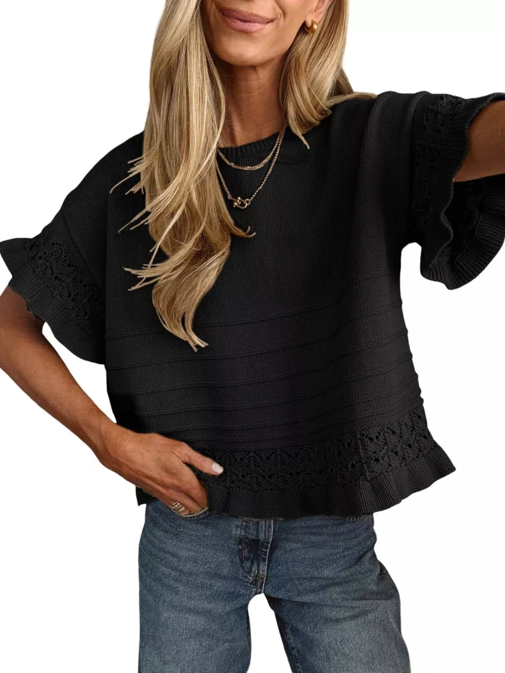Black knit top with crew neck, short ruffled sleeves, and lace trim hem.