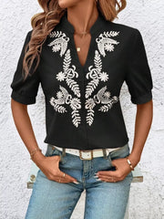 Black embroidered notched blouse with cuffed sleeves and V-neck.