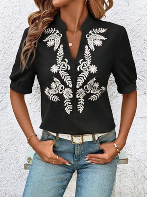 Black embroidered notched blouse with cuffed sleeves and V-neck.