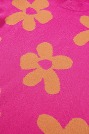 Cerise knit sweater with an allover retro floral print and crew neck detail.