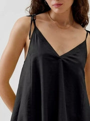 Black camisole with adjustable tie straps and V-neckline.