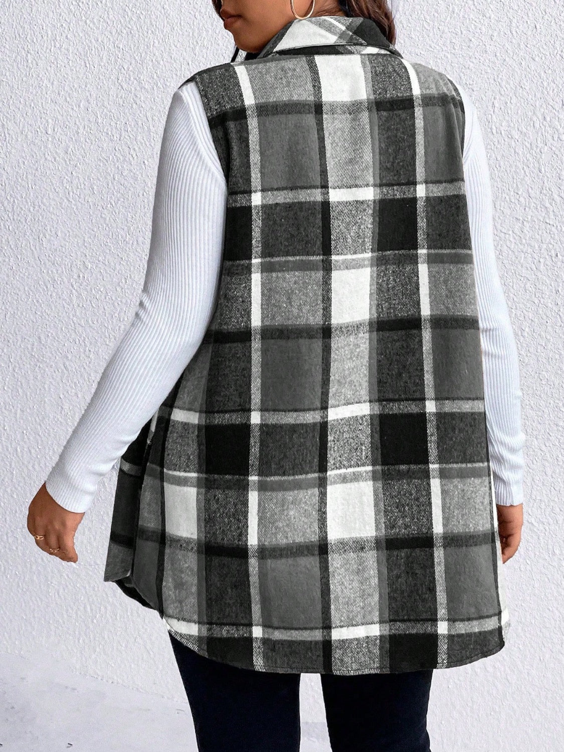 Oversized plaid shirt vest in black and white, featuring a collared neckline and buttoned front.