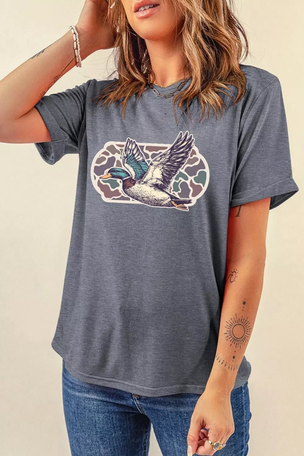 Gray polyester t-shirt with flying mallard duck graphic and camouflage oval.