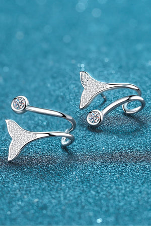 Silver stud earrings with crystal-embellished mermaid tails and round crystal accents.