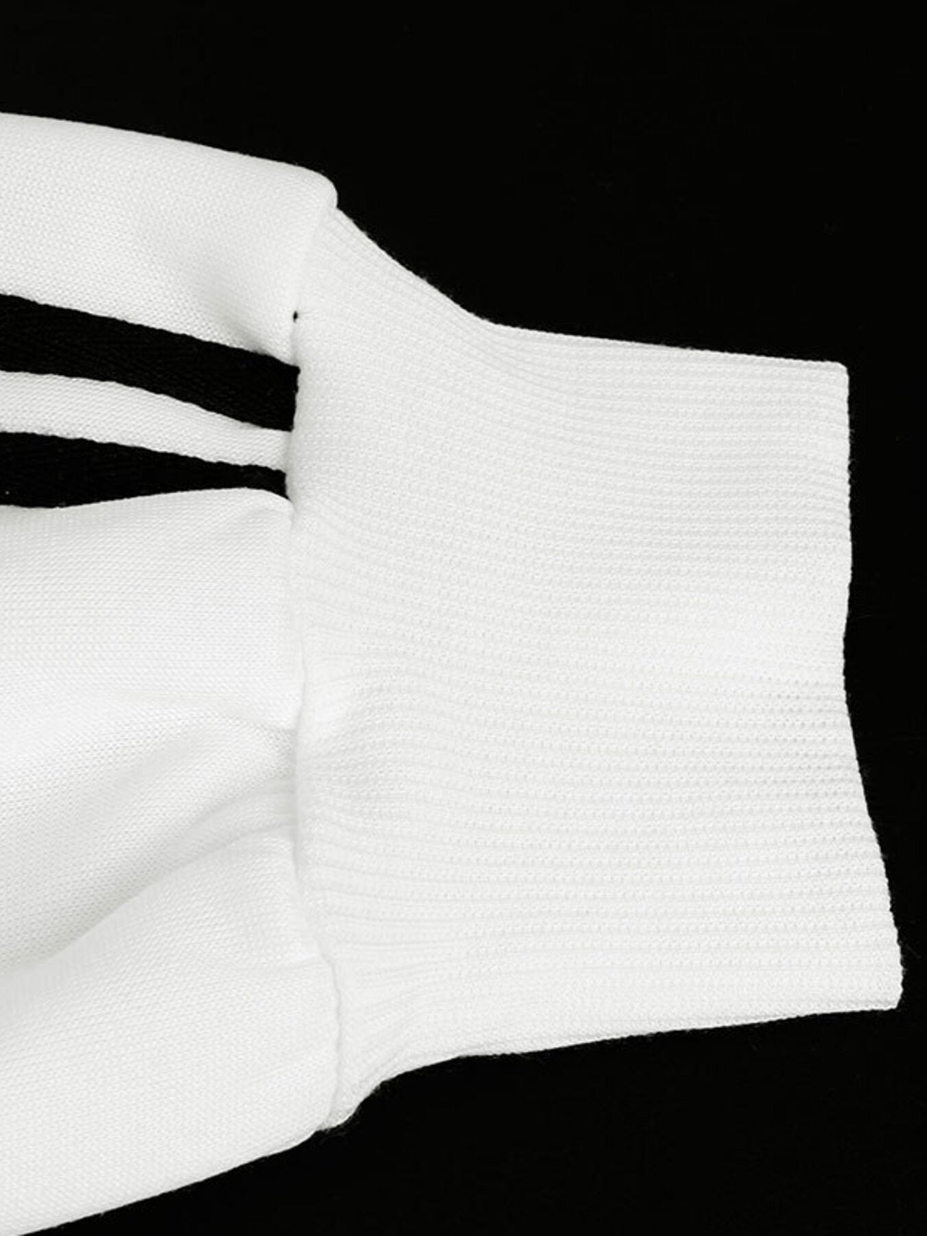 White zip-up hoodie with black stripes on sleeve and textured cuff
