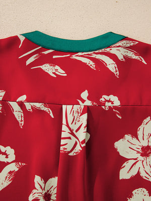 Red floral print blouse with green trim and pleat detail