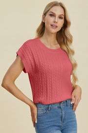 Cable knit cap sleeve pullover in strawberry with crew neck and textured vertical cables.
