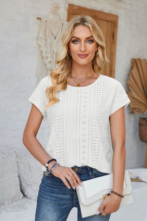 White perforated eyelet tee with cuffed short sleeves and round neckline.