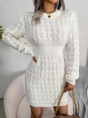 White cable knit mini dress with long sleeves and a sculpted fit.