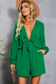 Mid Green tie-front blouson sleeve playsuit with smocked cuffs and a plunging neckline.