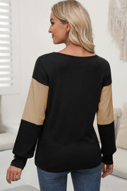 Black sweater with contrast khaki sleeves and button cuff detail