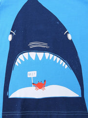 Blue cotton t-shirt with a graphic of a shark's open mouth, a crab holding a HELP sign on an island.