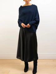 Dark Blue off-shoulder knit sweater with textured cuffs and batwing sleeves.