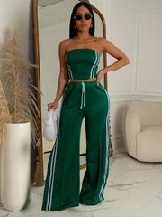Dark green tube top and wide-leg pant set with white stripe details and drawstring waist.