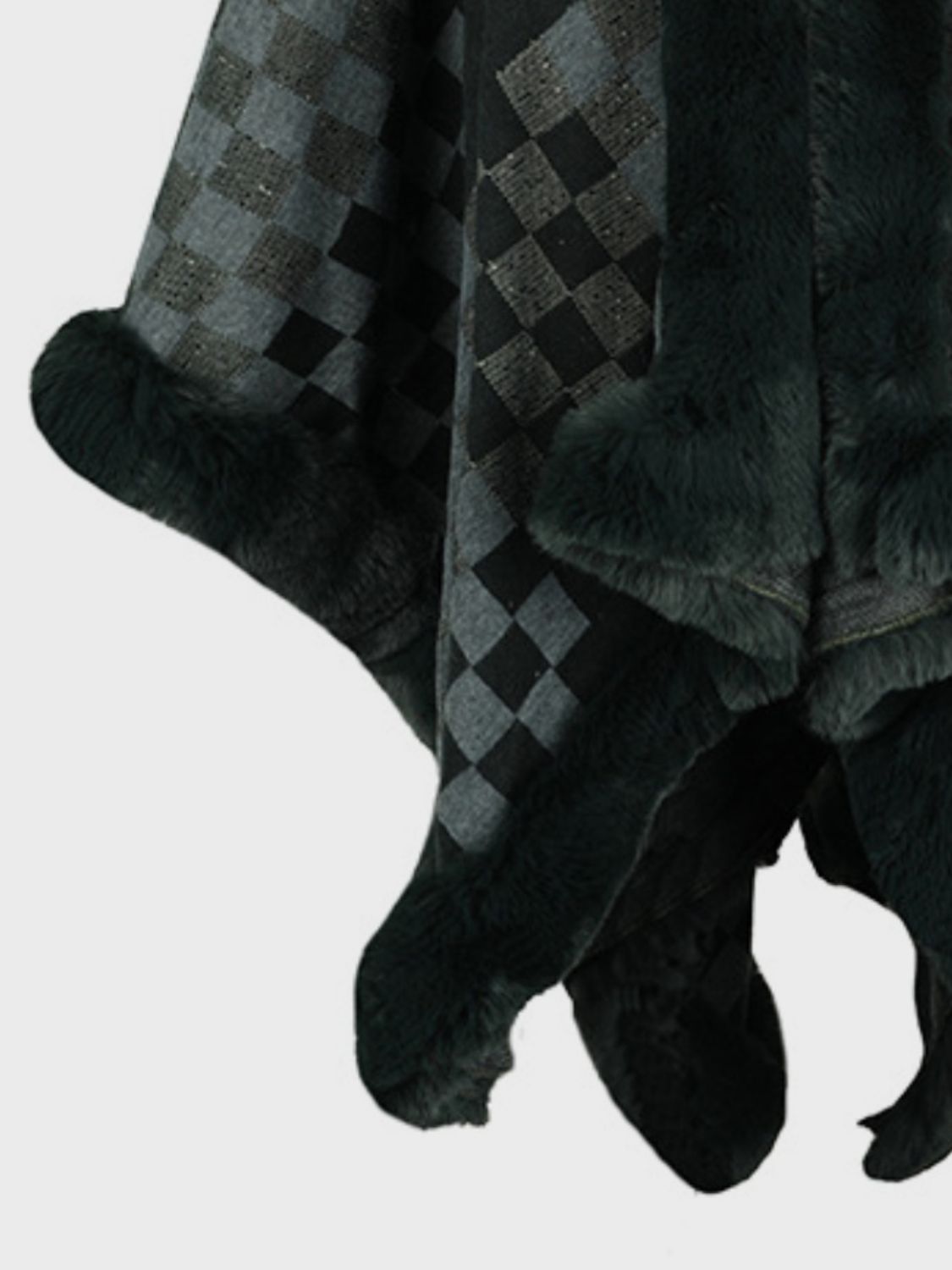 Checkered cape in black and grey with faux fur trim.