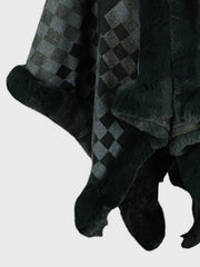 Checkered cape in black and grey with faux fur trim.