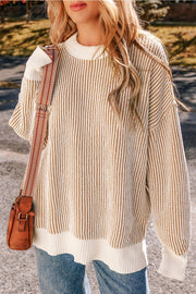 Camel and cream vertical stripe drop-shoulder knit sweater with crew neck and ribbed trim.