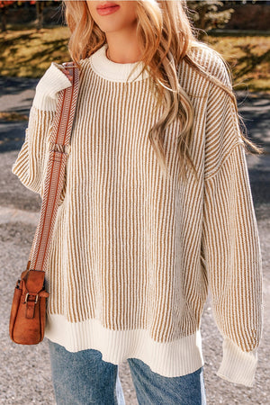 Camel and cream vertical stripe drop-shoulder knit sweater with crew neck and ribbed trim.