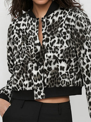 Boxy bomber jacket in leopard print with two front pockets and black ribbed cuffs.