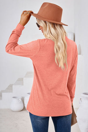 Coral henley neckline jersey top with long sleeves and a relaxed fit.