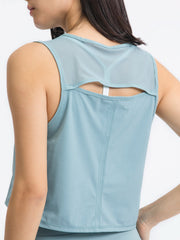 Light Blue mesh-inset back cropped active tank with cutout detail.