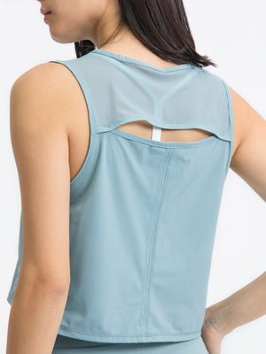 Light Blue mesh-inset back cropped active tank with cutout detail.