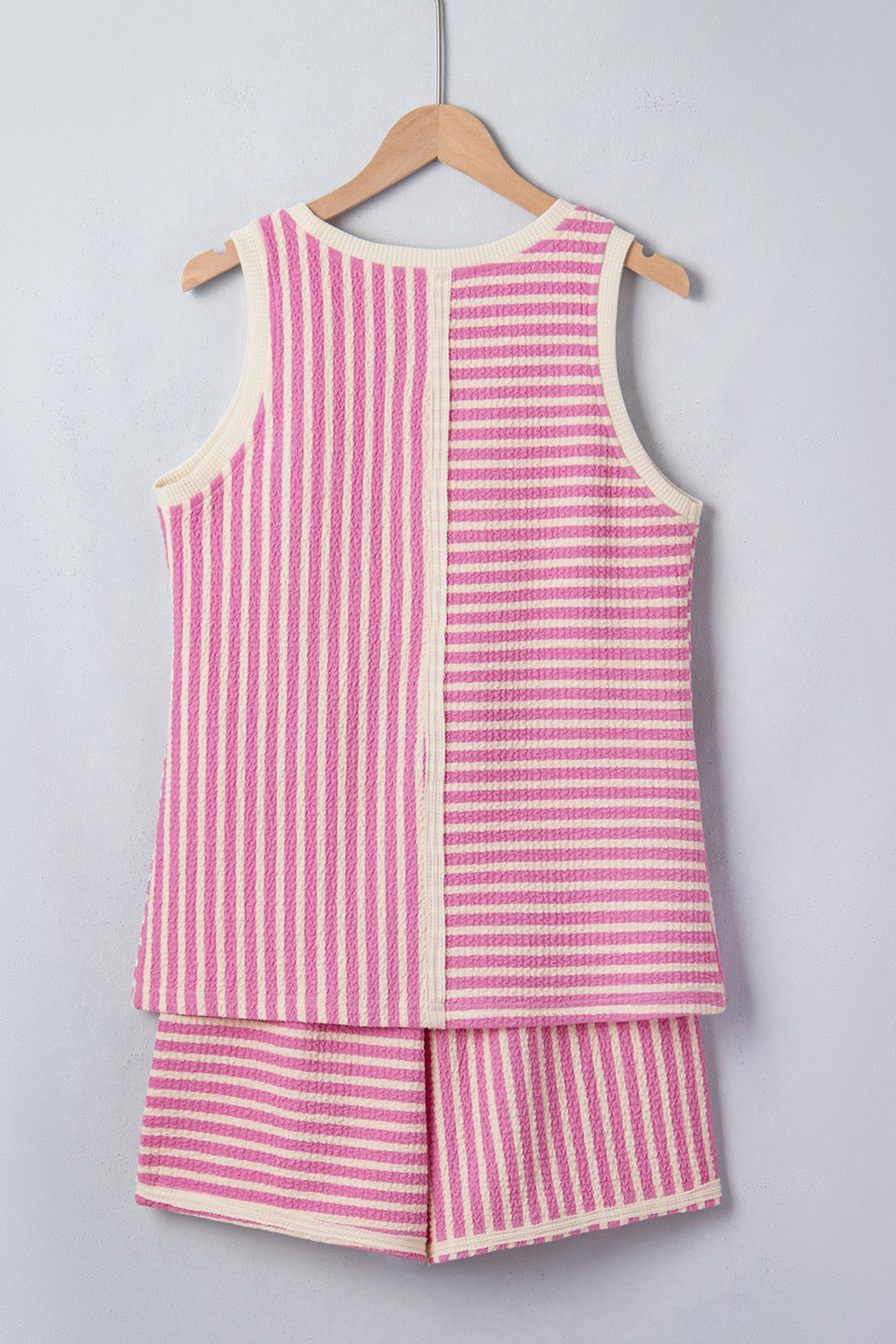 Textured stripe two-piece set with pink and cream vertical and horizontal stripes.
