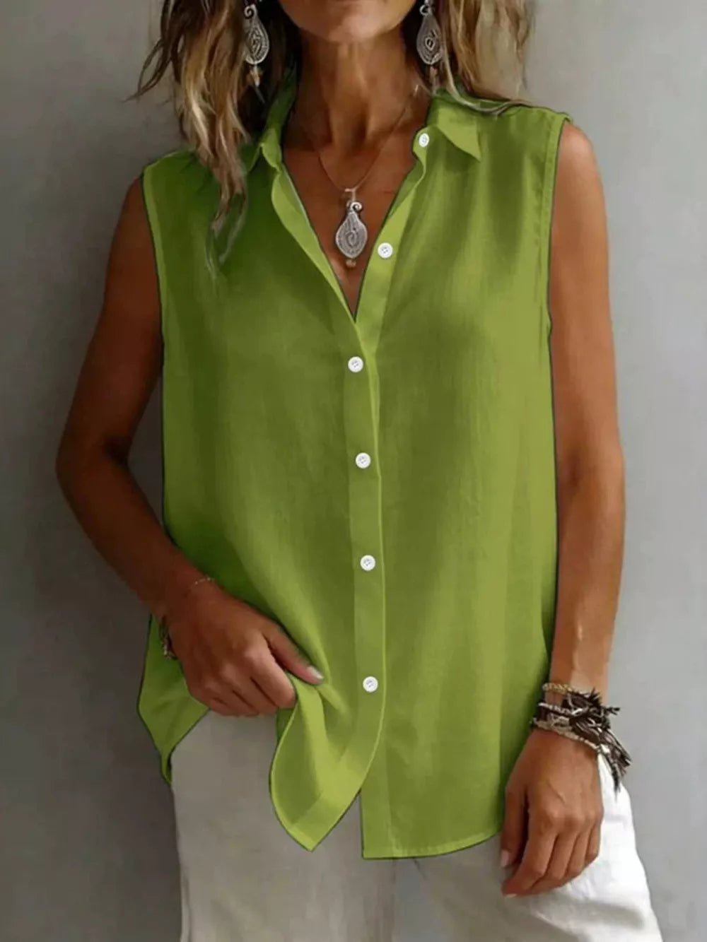 Effortless sleeveless button-up shirt in matcha green with a collared neckline.