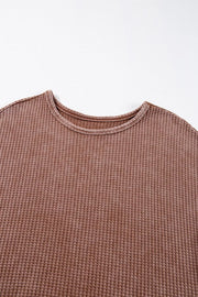 Waffle Knit Fringed High Low Loose Top in Brown, back view