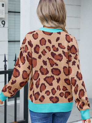 Leopard print knit sweater in khaki with blue trim and crew neck.