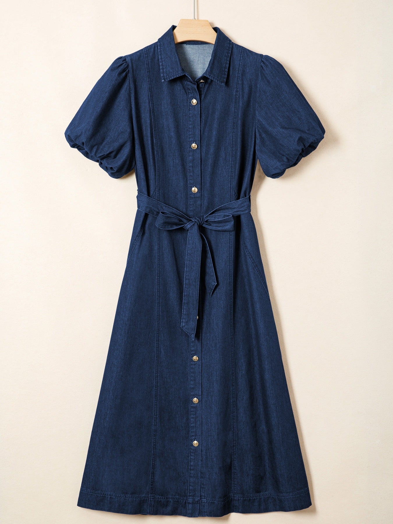 Denim midi dress with puff sleeves, collared neckline, button front, and tie belt.