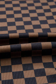 Checkerboard knit t-shirt in dark brown and navy with a ribbed texture.