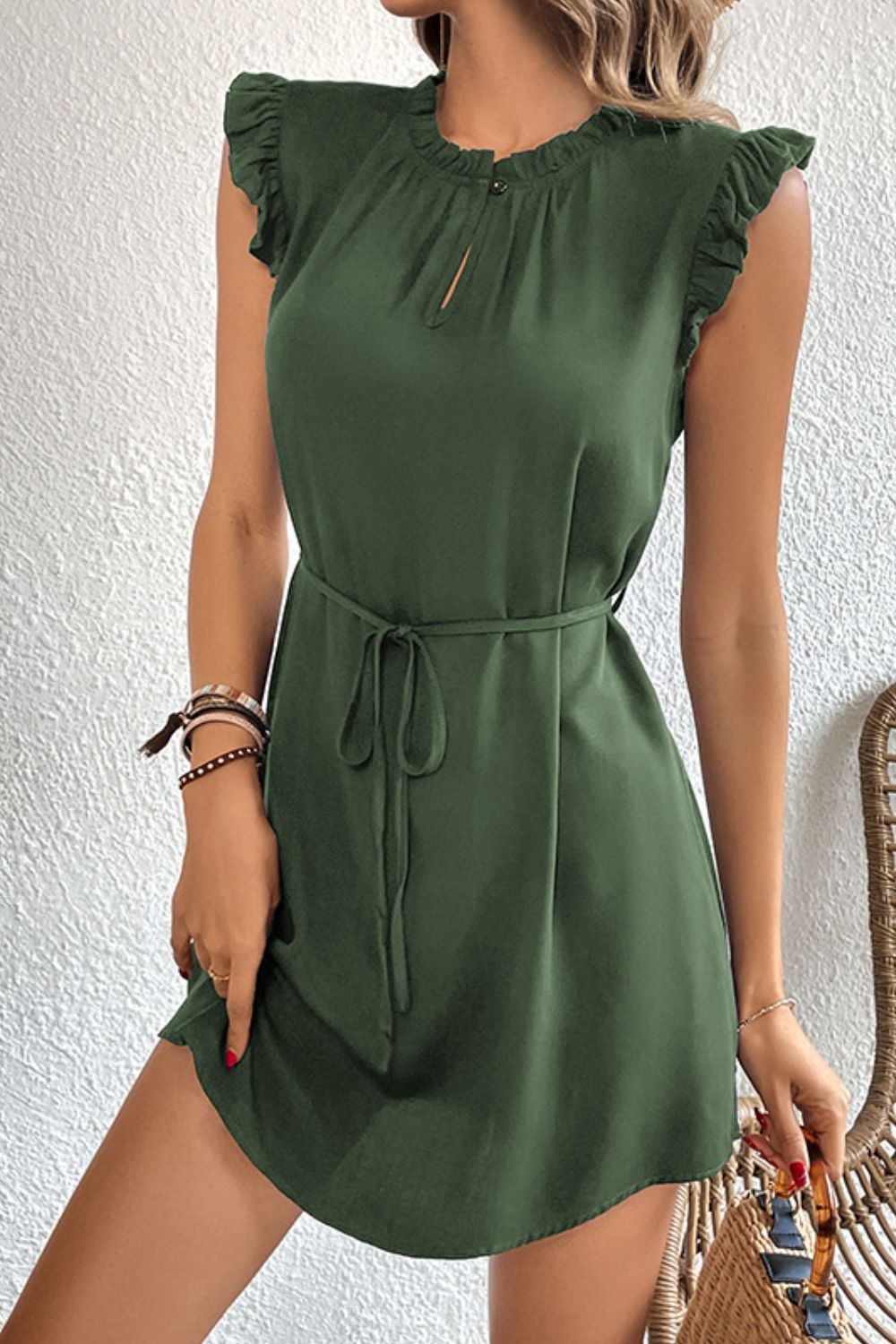 Army green mini dress with ruffled yoke, keyhole neckline, short sleeves, and tie waist.