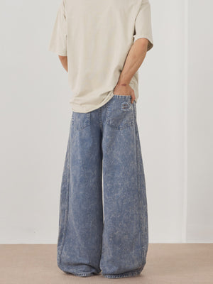 Men's blue acid wash distressed wide-leg denim jeans with a casual fit.