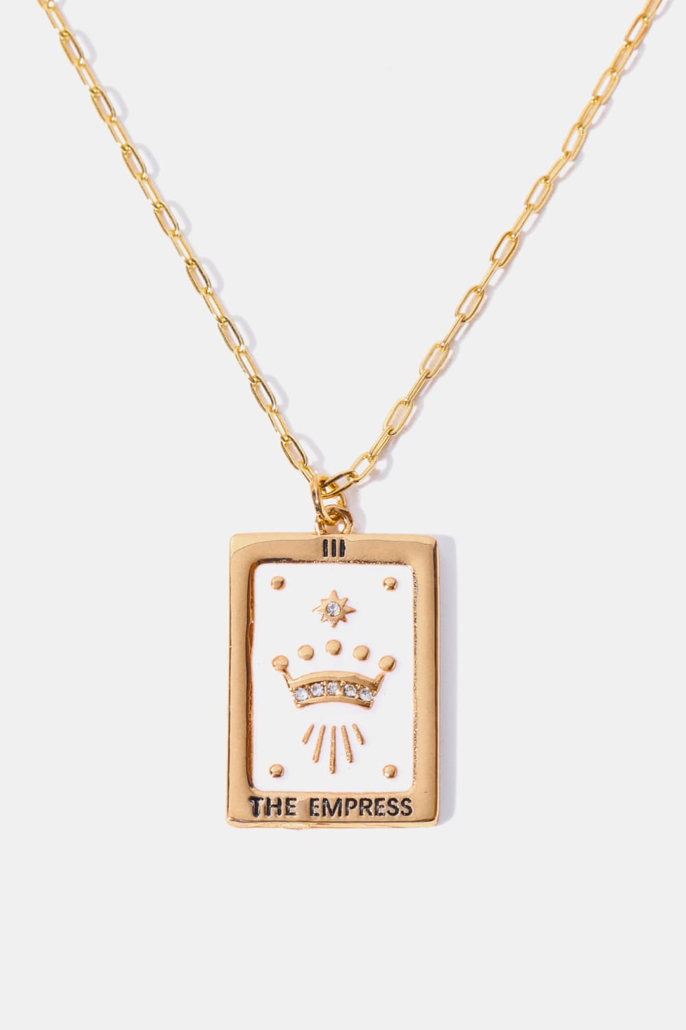 Gold chain necklace with a white and gold "The Empress" tarot card pendant featuring a crown and star detail.